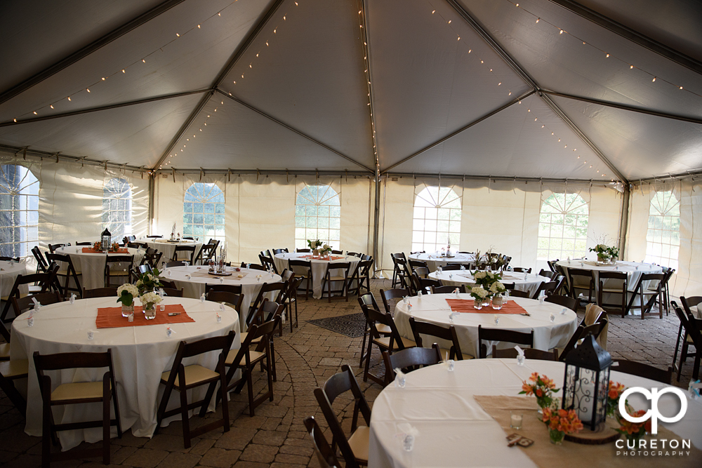 A tent over the courtyard of the Bleckley Inn setup for a wedding reception.