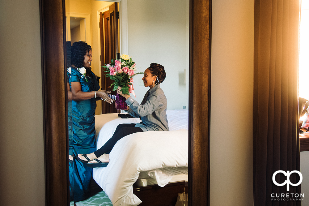 The bride received flowers from her groom before the wedding.