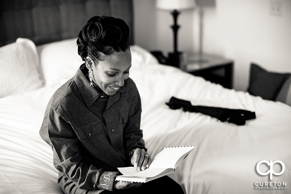 Bride reading a note from her groom.