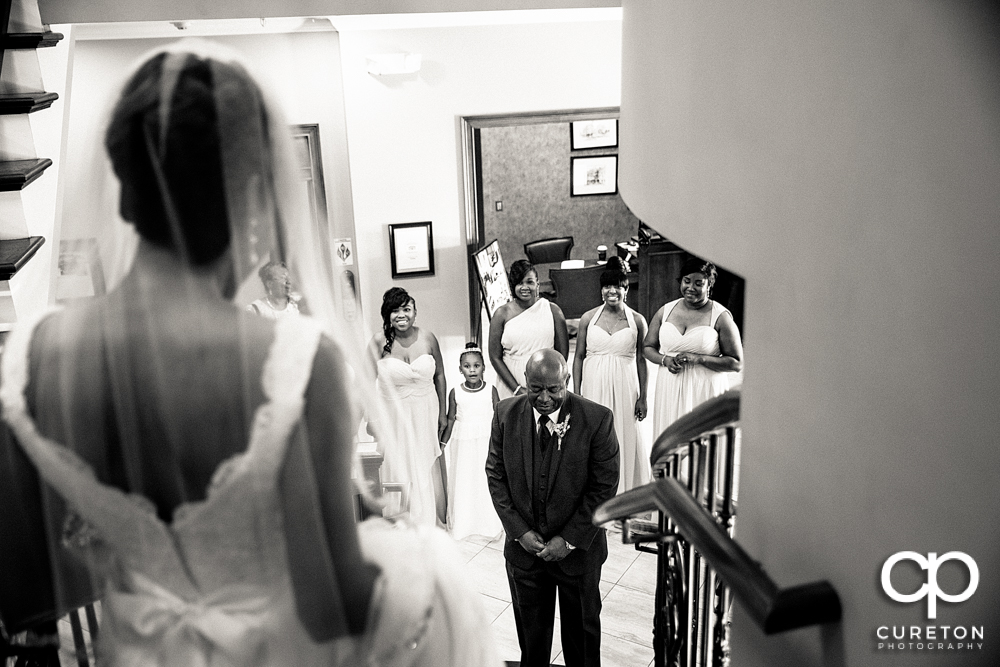 Bride doing a first look with her father.
