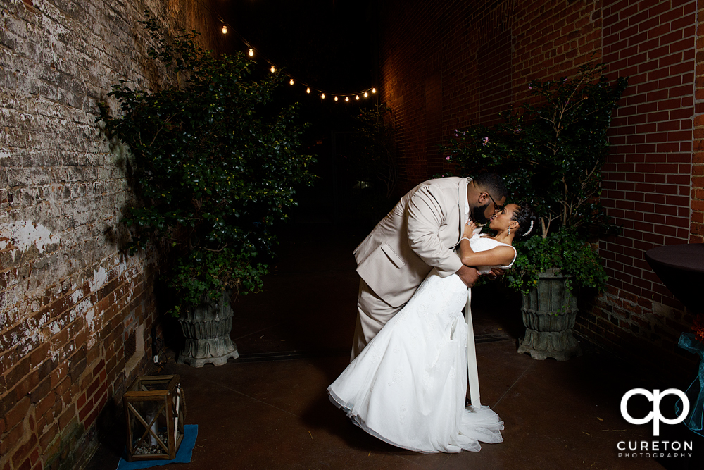 Bride and groom dancing in the alley of the Bleckley Inn.