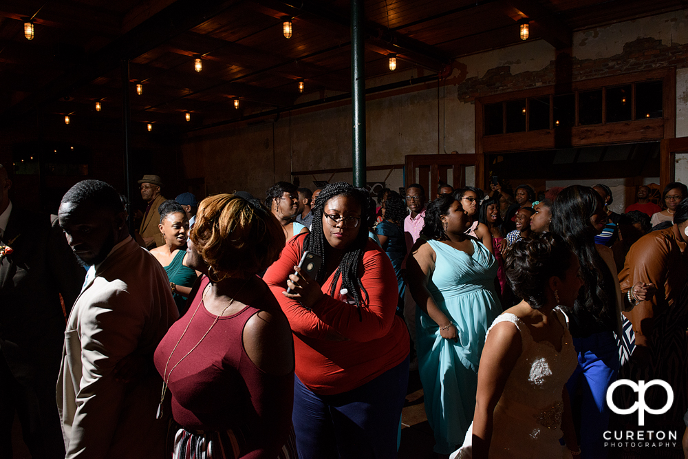 Wedding guests dance at the Bleckley Inn to the sounds of DJ Fresh.