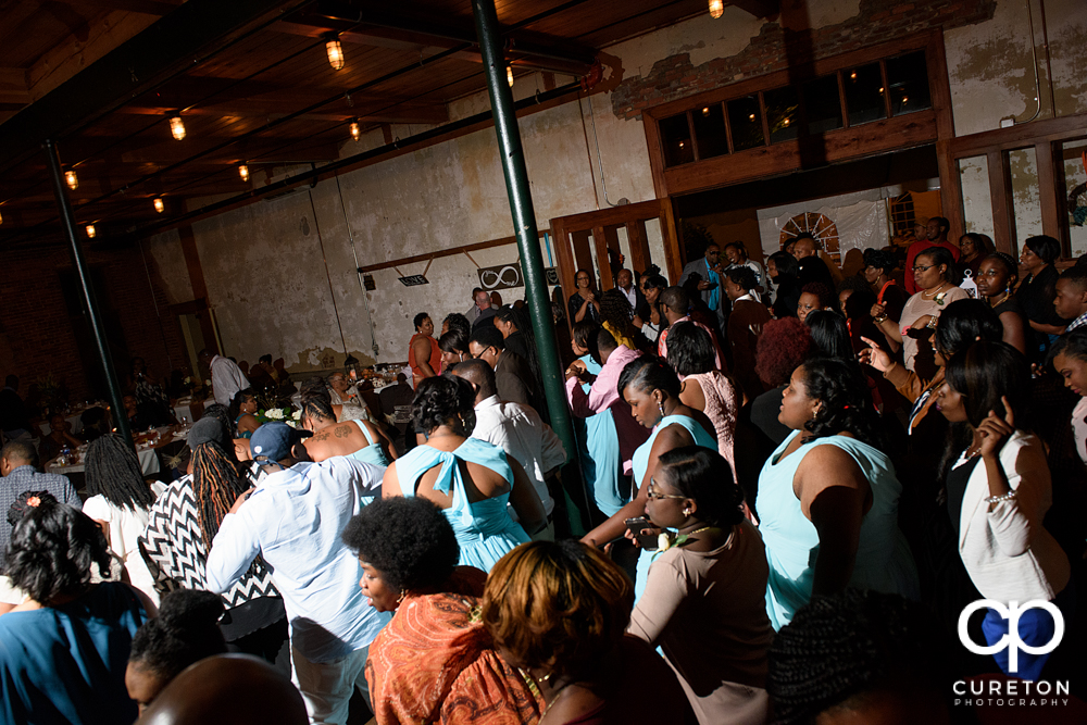 Wedding guests dance at the Bleckley Inn to the sounds of DJ Fresh.