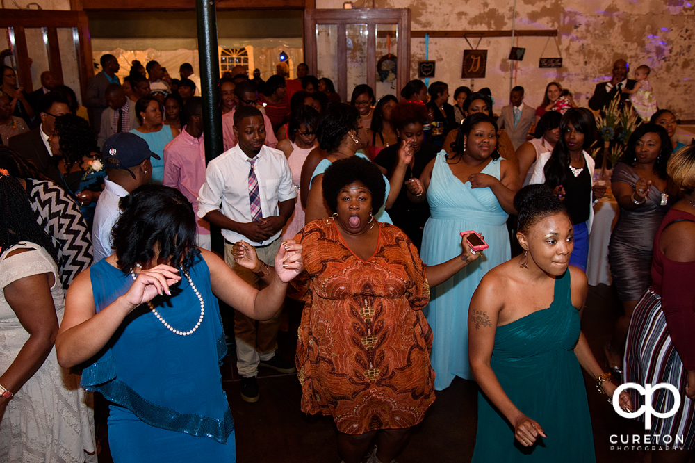 Wedding guests dance at the Bleckley Inn to the sounds of DJ Fresh.