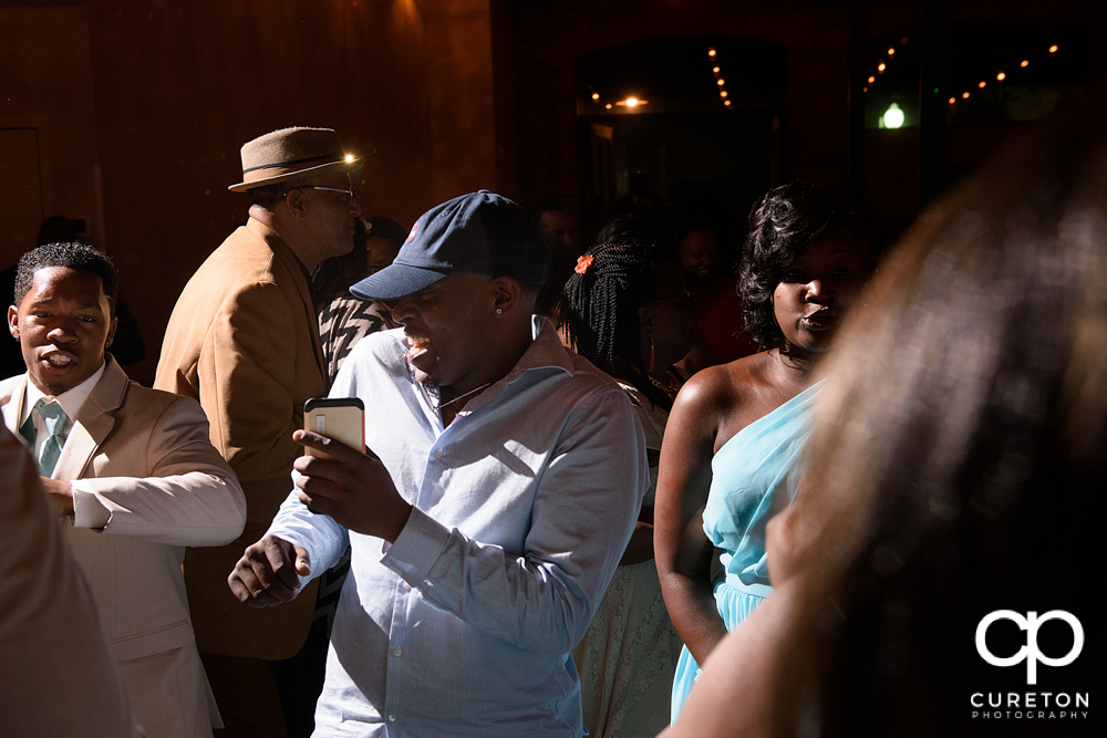 Wedding guests dance at the Bleckley Inn to the sounds of DJ Fresh.