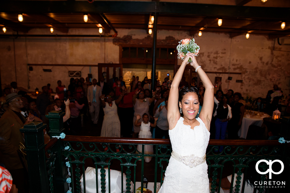 Bride tossing the bouquet.