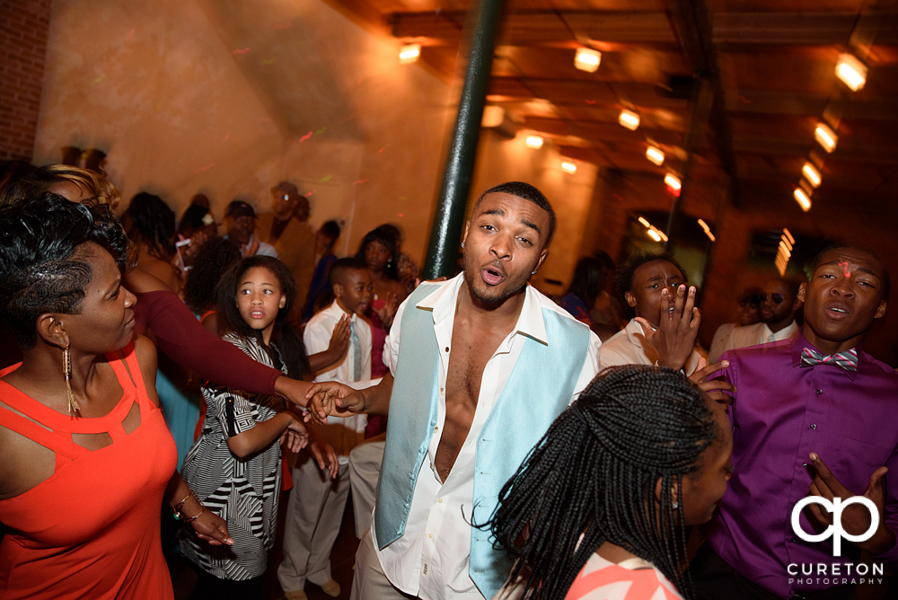 Wedding guests dance at the Bleckley Inn to the sounds of DJ Fresh.