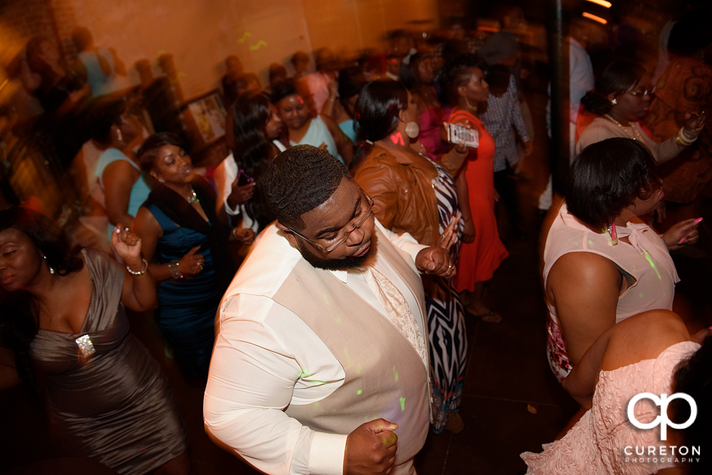 Wedding guests dance at the Bleckley Inn to the sounds of DJ Fresh.