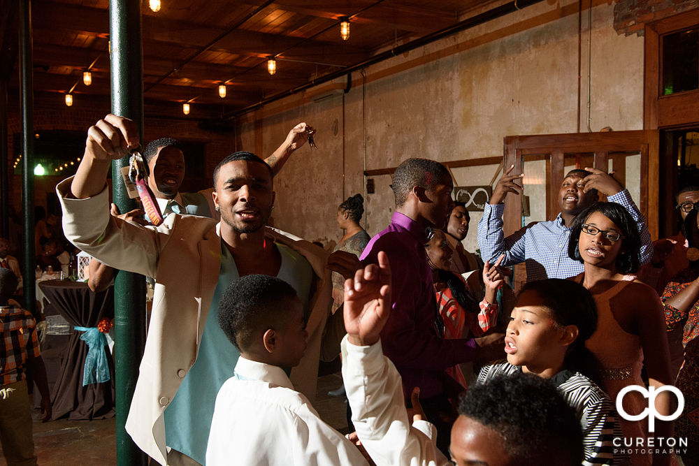 Wedding guests dance at the Bleckley Inn to the sounds of DJ Fresh.