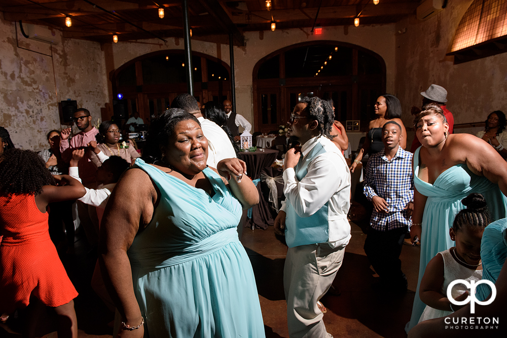 Wedding guests dance at the Bleckley Inn to the sounds of DJ Fresh.