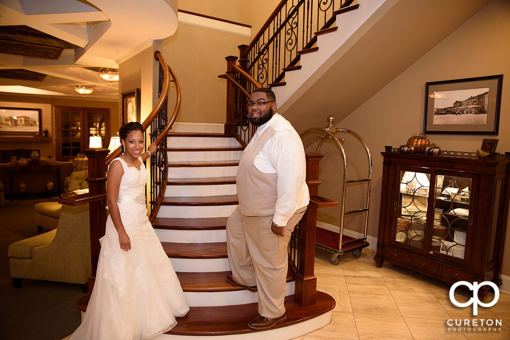 The bride and groom going upstairs.