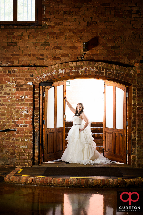 Bride standing in the doorway.