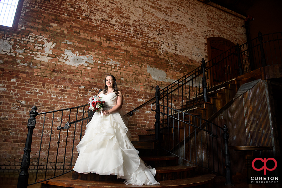 Bide standin on a staircase.