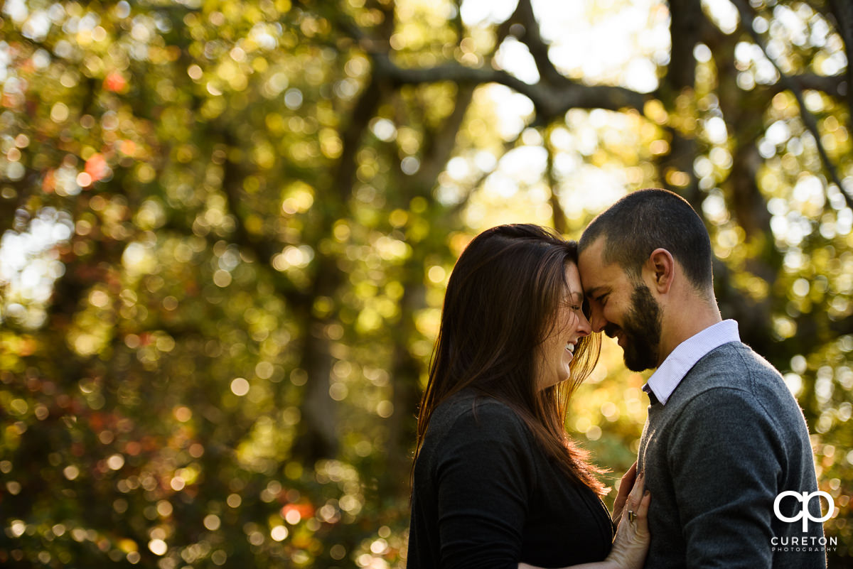 Future bride and groom cuddling during a Caesars Head engagement session.