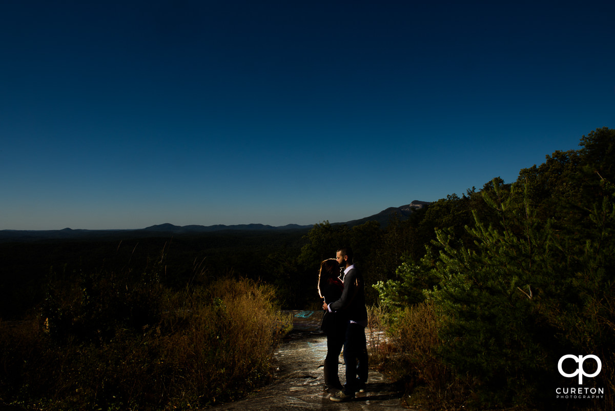Bride and groom silhouetted at Bald Rock.