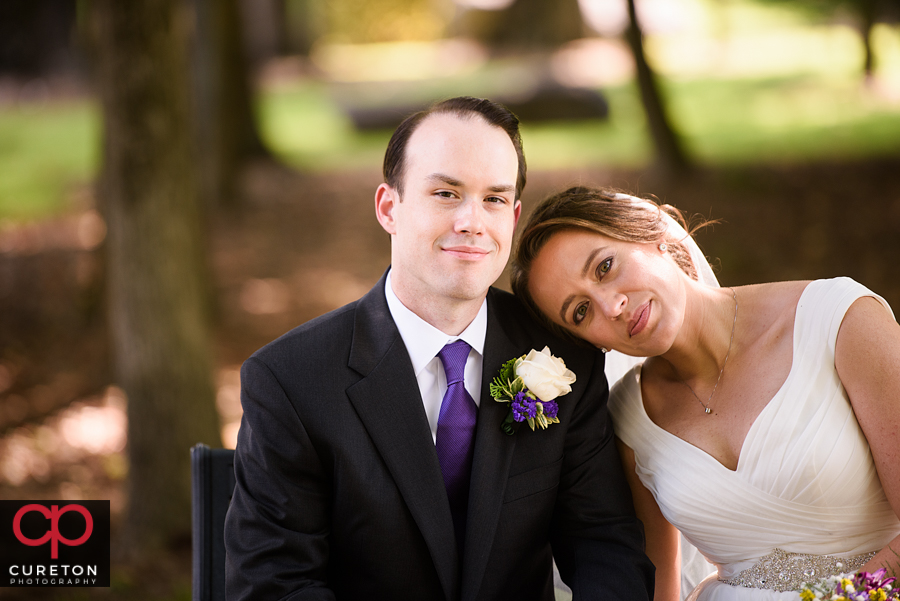 Bride and Groom in a park after their wedding in Charlotte,NC.