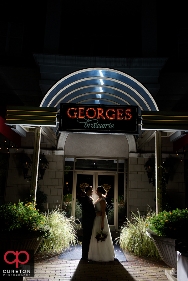 Bride and Groom outside their wedding reception at George's Brasserie in Charlotte,NC.