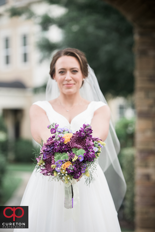 Beautiful bride with her flowers after her wedding in Charlotte.