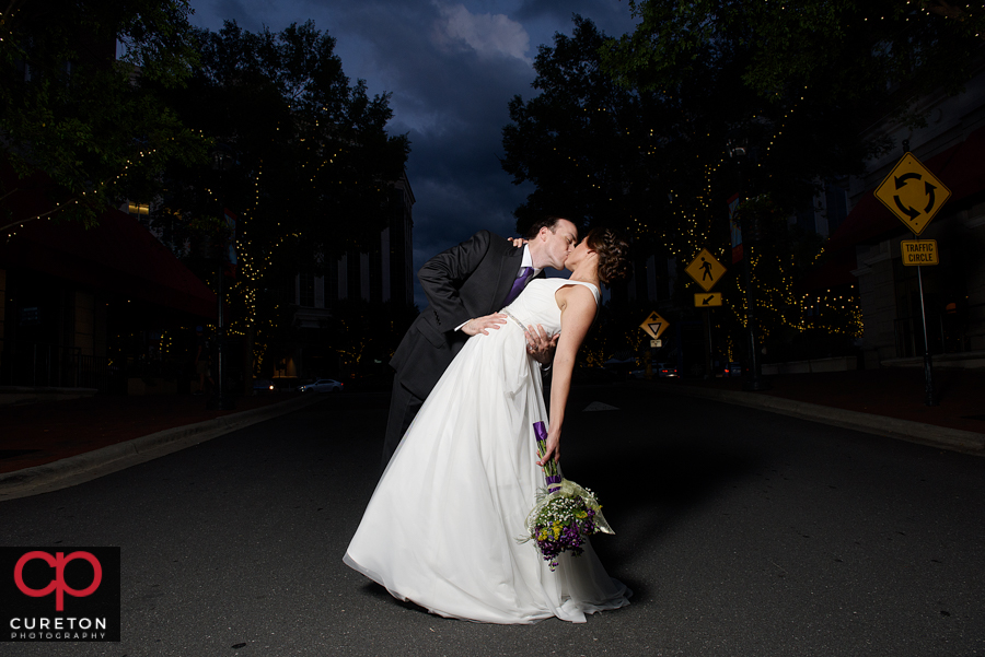 Bride and groom walking in the streets of downtown Charlotte NC.