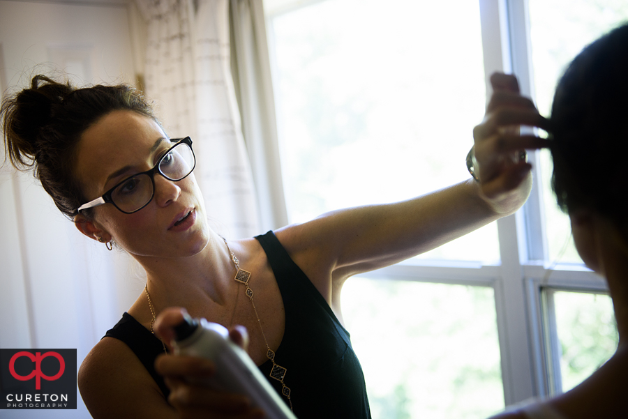 Bride's makeup being applied.