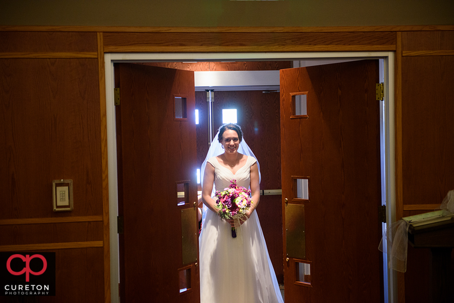 Bride making her entrance into her wedding at St. Matthew Catholic church in Charlotte NC.
