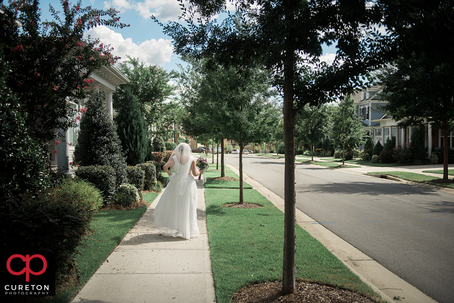 Bride walking down the street.