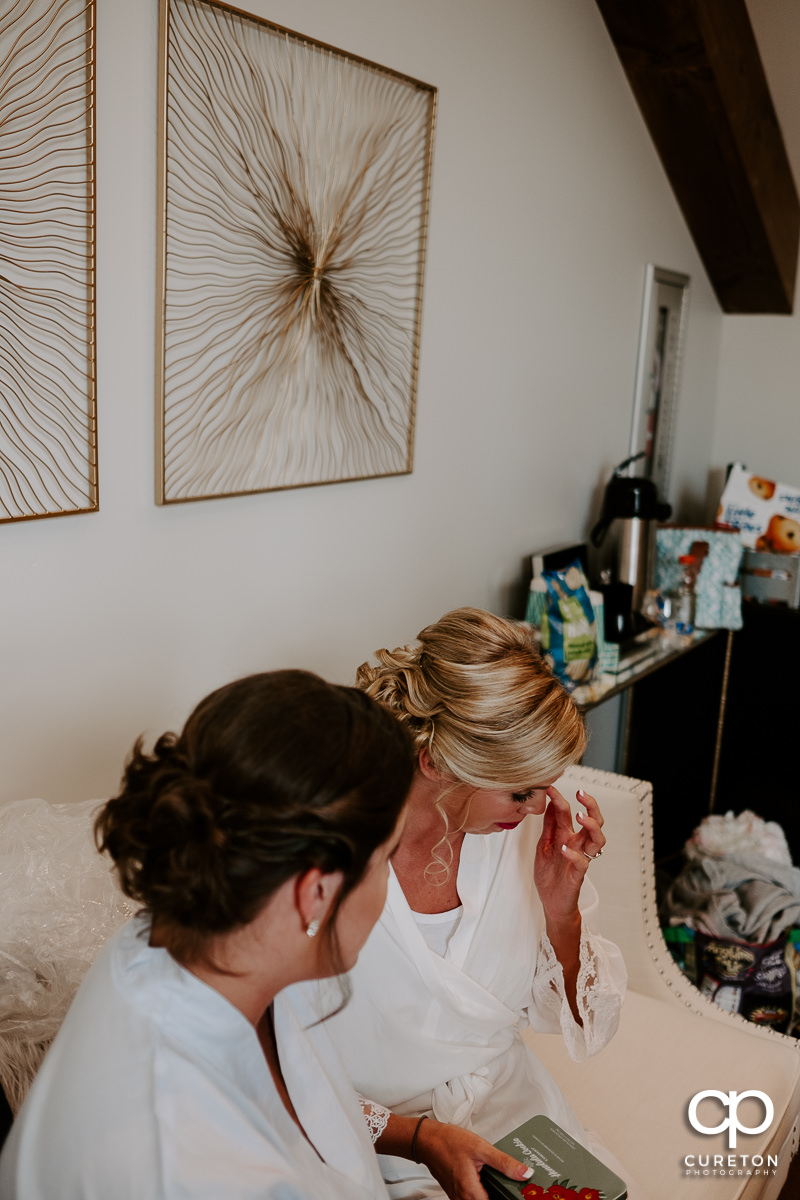 Bride crying before her wedding.