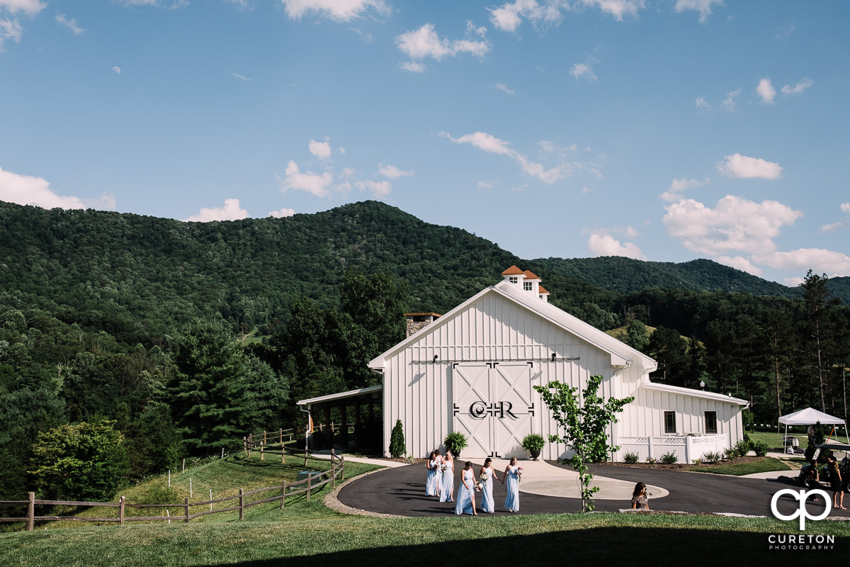 Bridesmaids walking to the chapel at Chestnut Ridge.