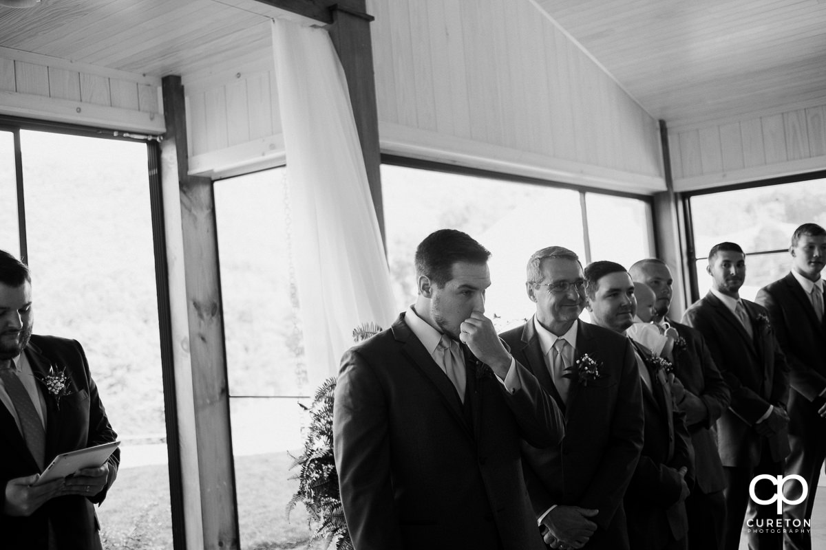 Groom trying to hold back tears seeing his bride walking down the aisle at Chestnut Ridge in Canton.NC.