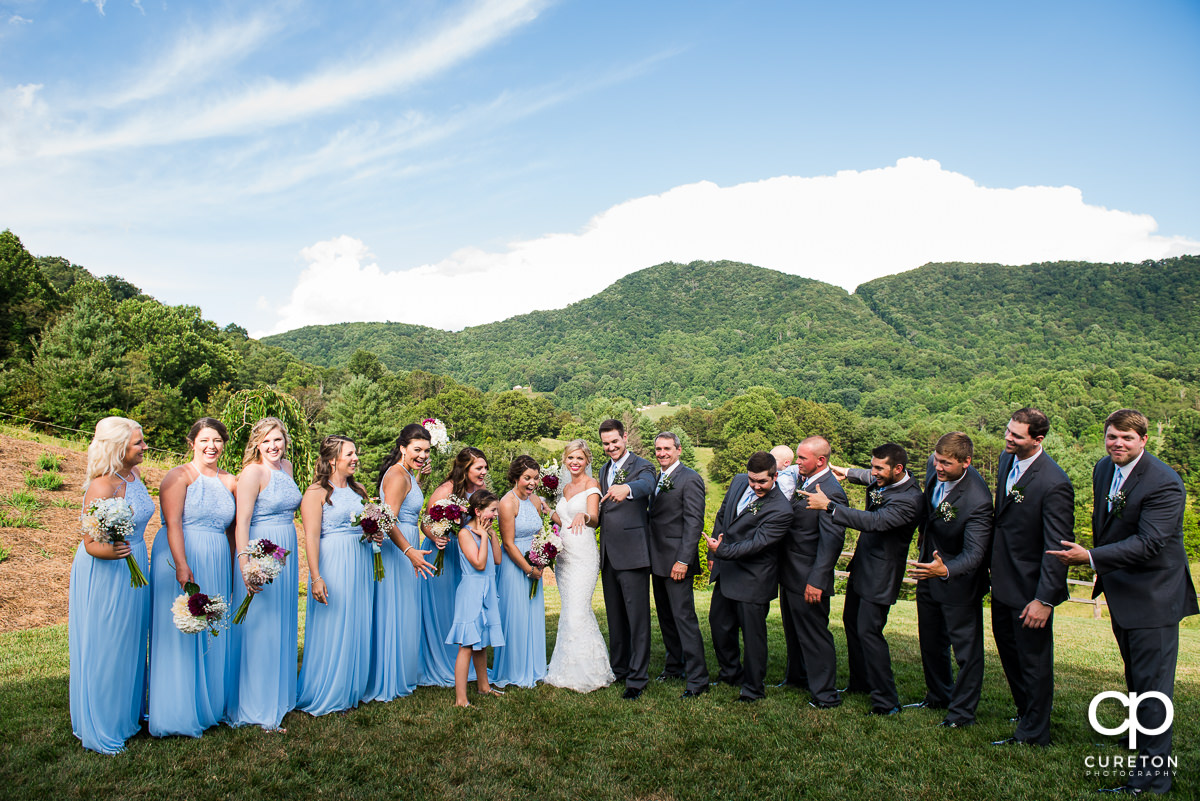 Wedding party excited as the bride shows off her wedding ring.