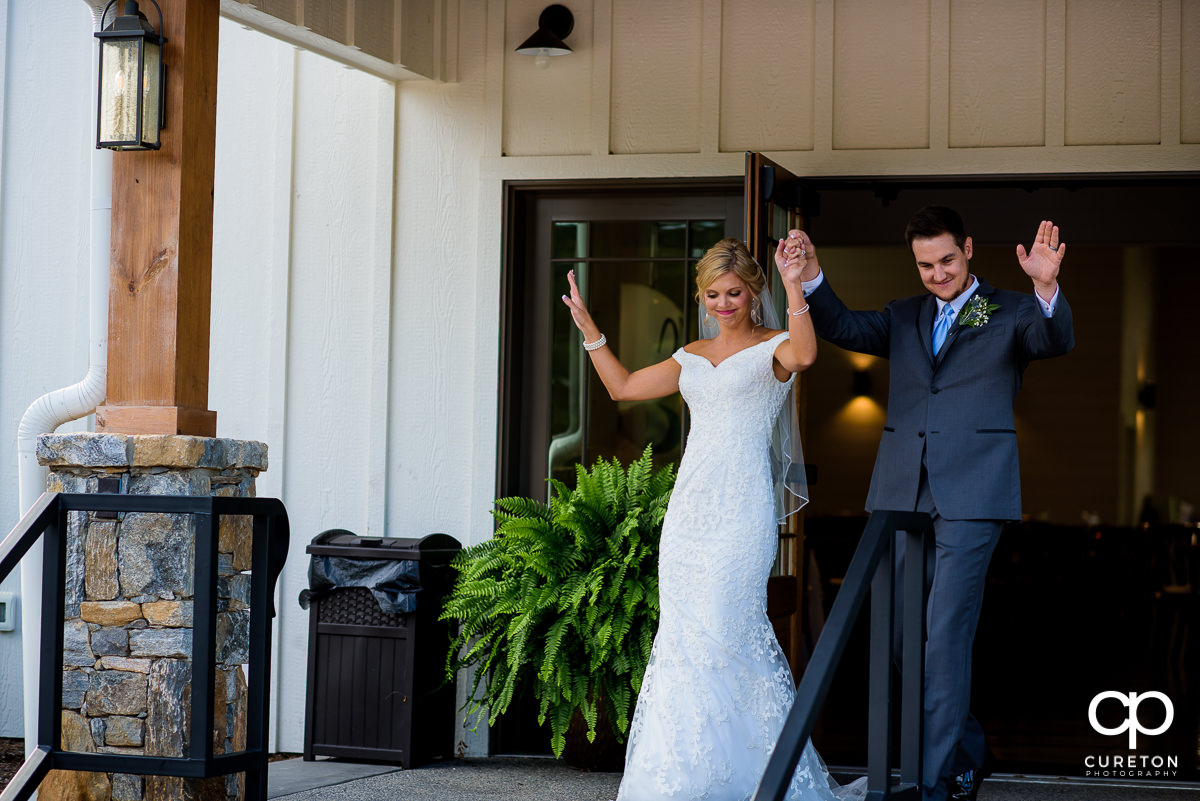 Newlyweds being introduced into the reception.