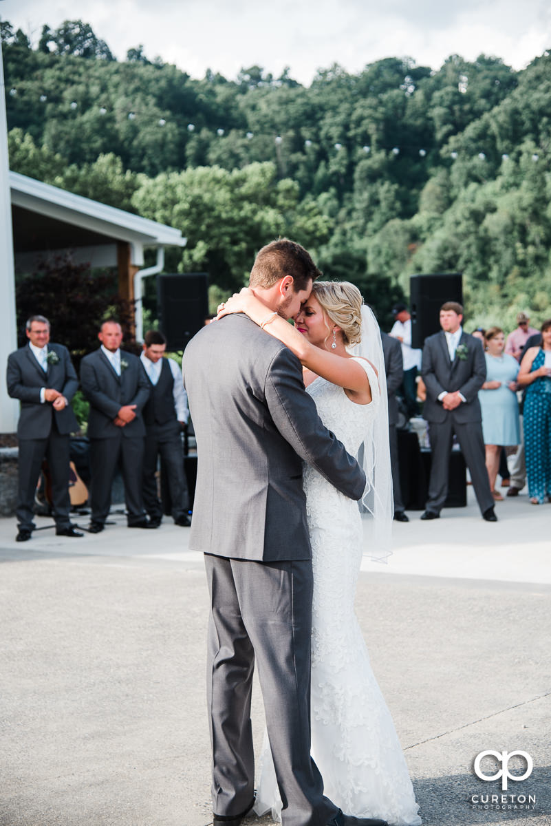 Newlyweds sharing a first dance.