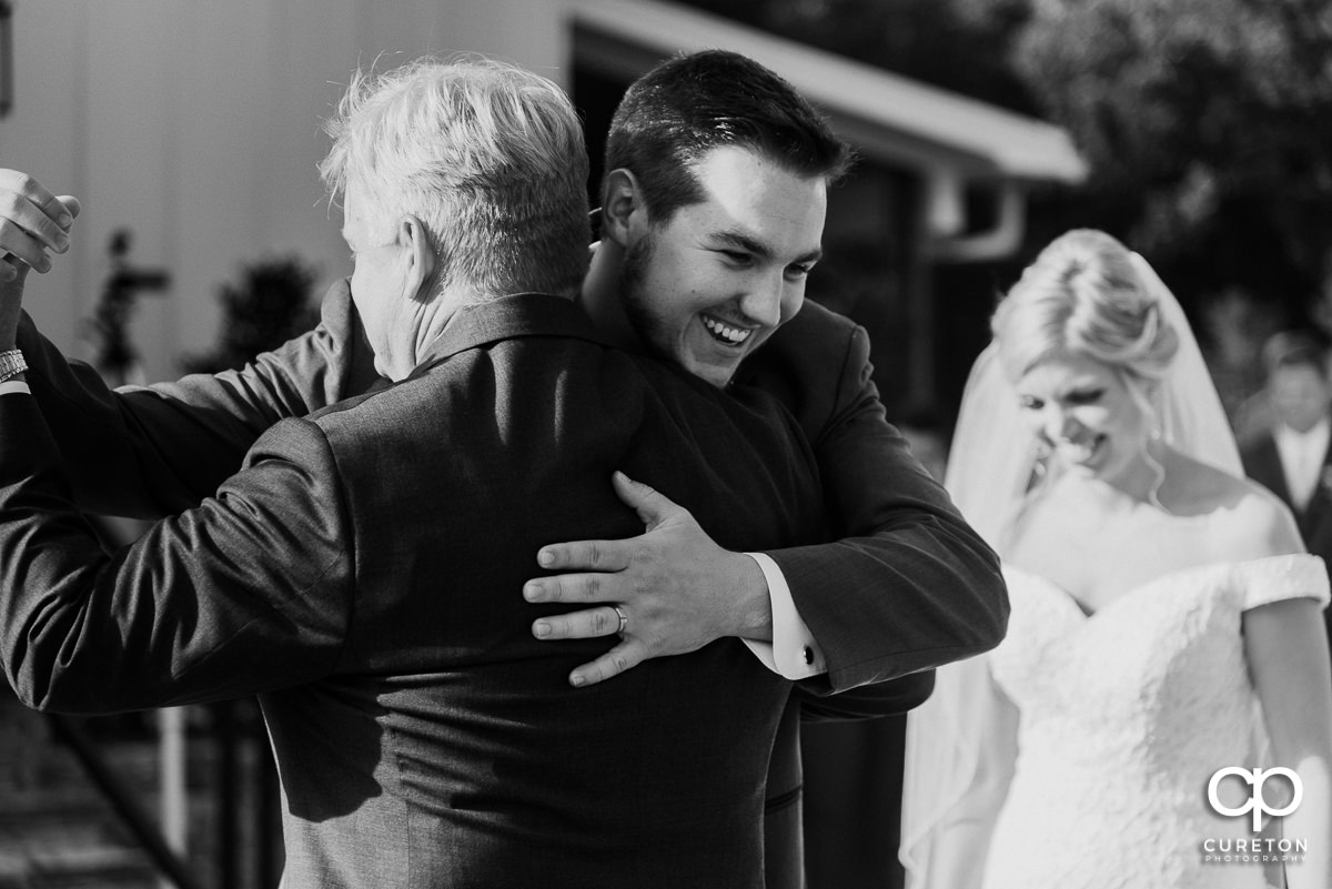 Groom dancing with the bride's father.