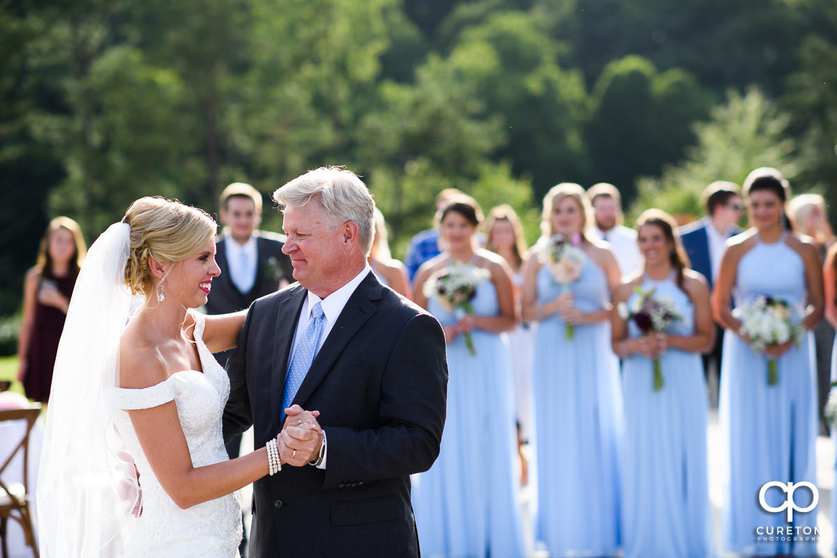 Bride dancing with her dad at the wedding reception.