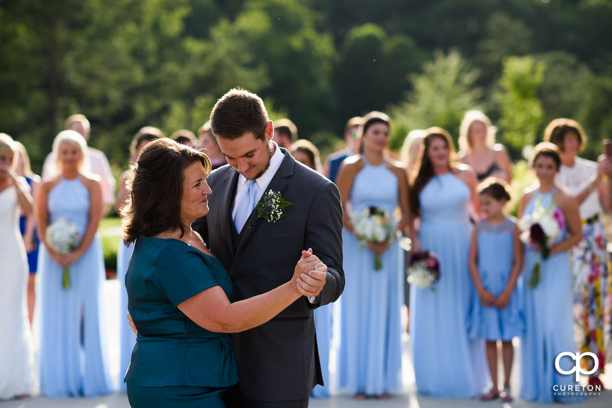 Groom dancing with his mom.