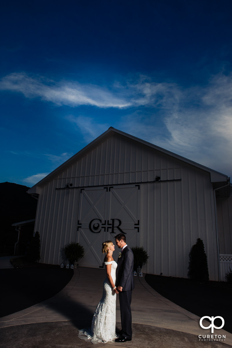 Bride and groom at sunset in the mountains.