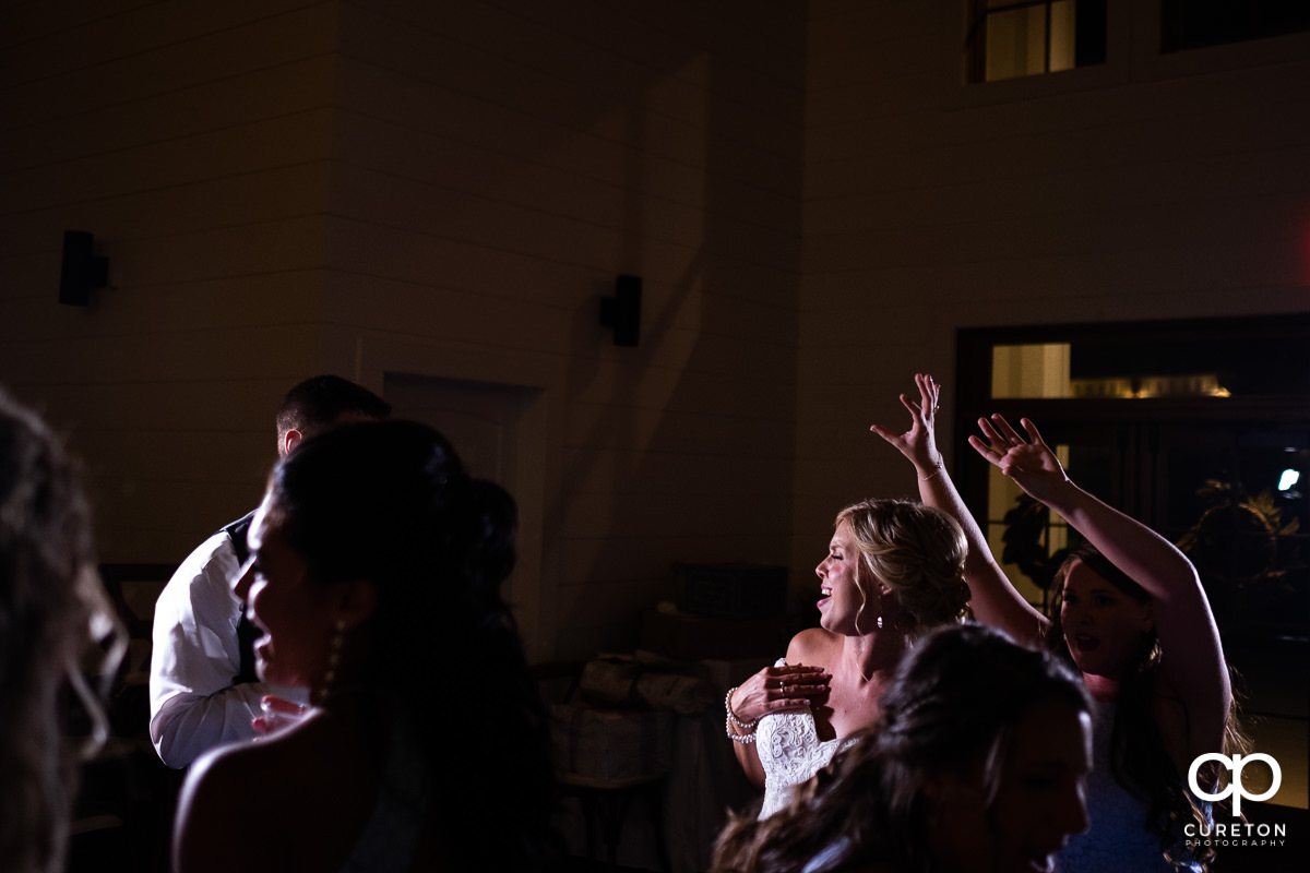 Bride dancing with her friends.