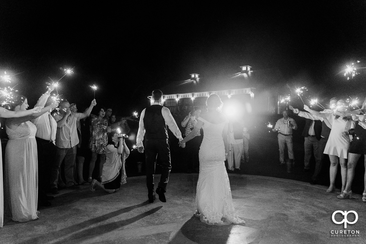 Bride and groom leaving the Chestnut Ridge wedding reception.