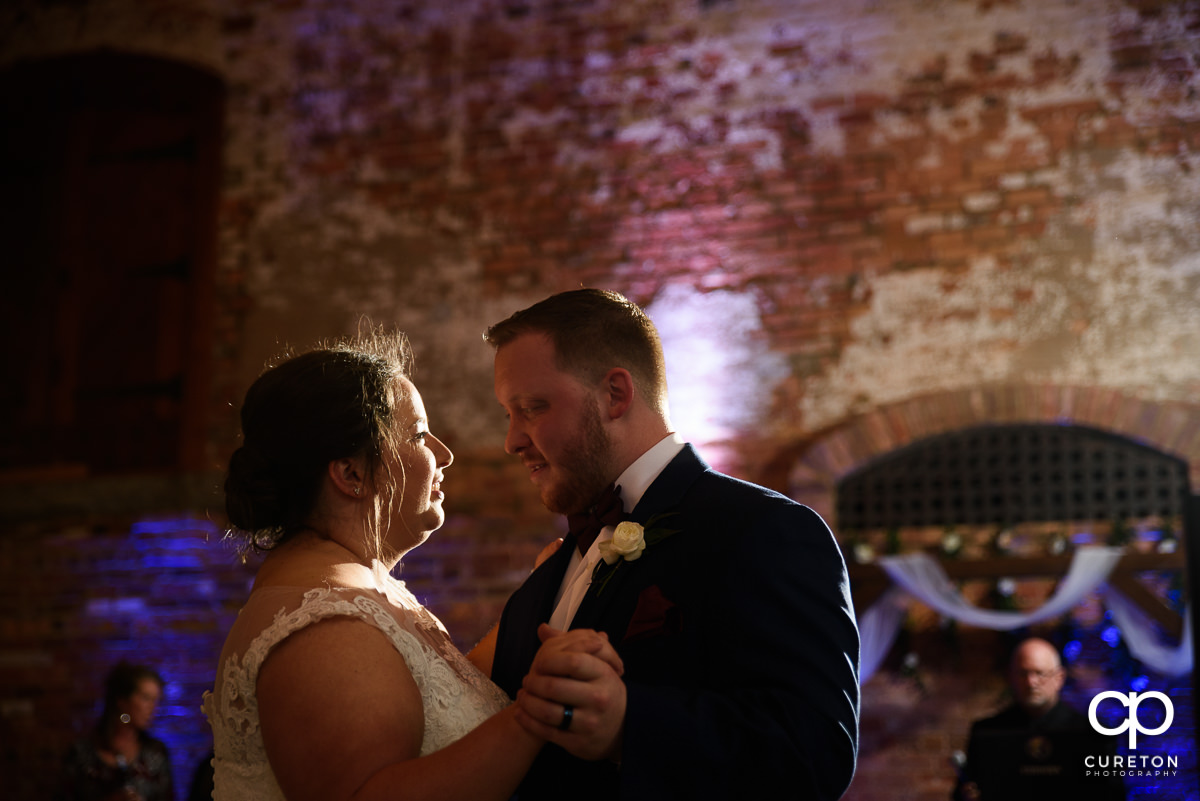 Bride and groom first dance at the wedding reception in Greenville at The Old Cigar Warehouse.