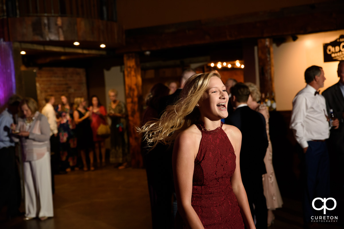 Guests dancing at The Old Cigar Warehouse to the sounds of Greenville wedding DJ Jumping Jukebox.