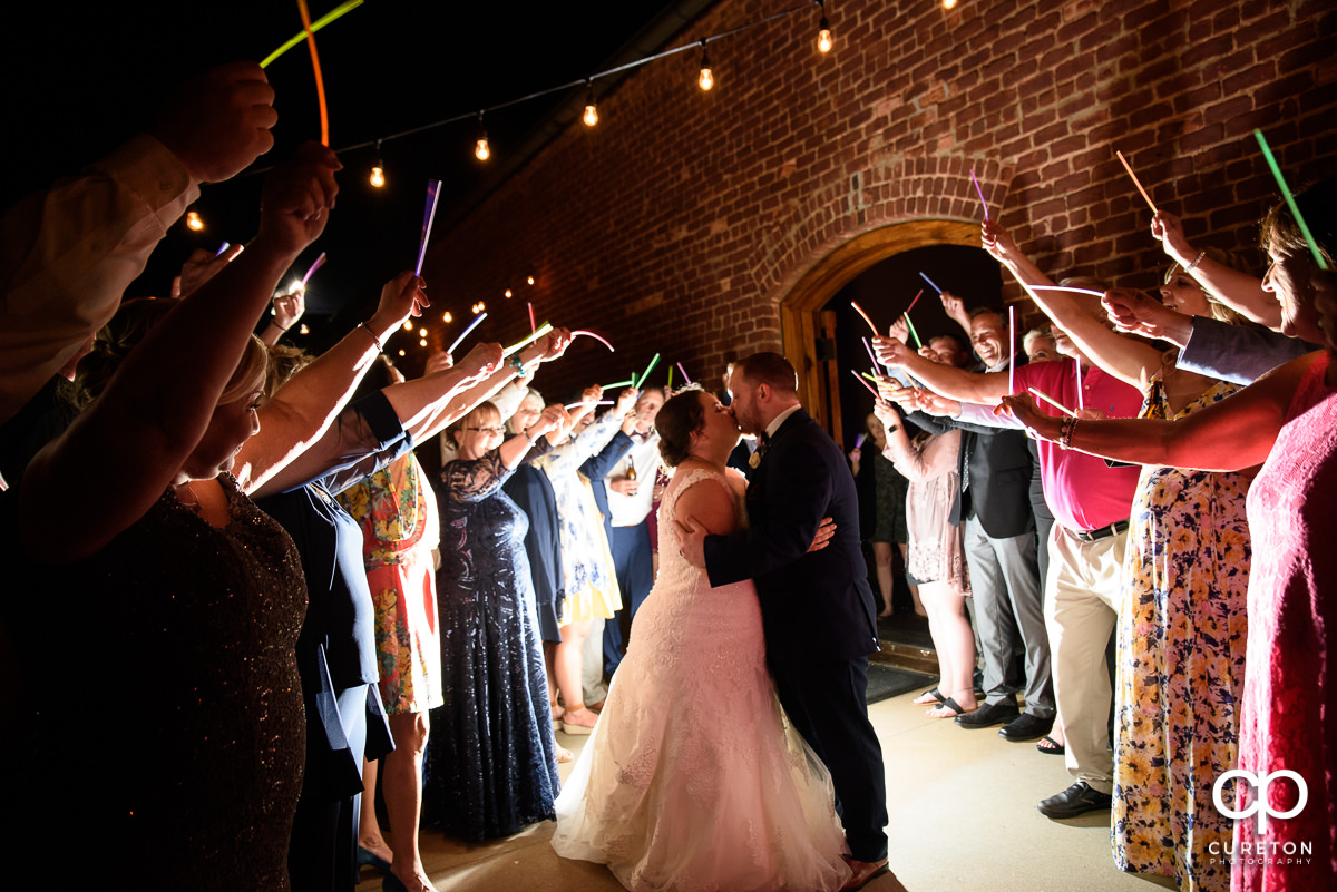 Bride and groom making a grand exit at The Old Cigar Warehouse wedding.