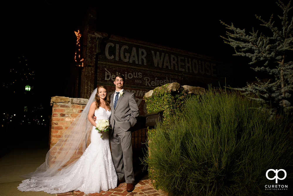 Brie and Groom on Main Street Greenville after dark.