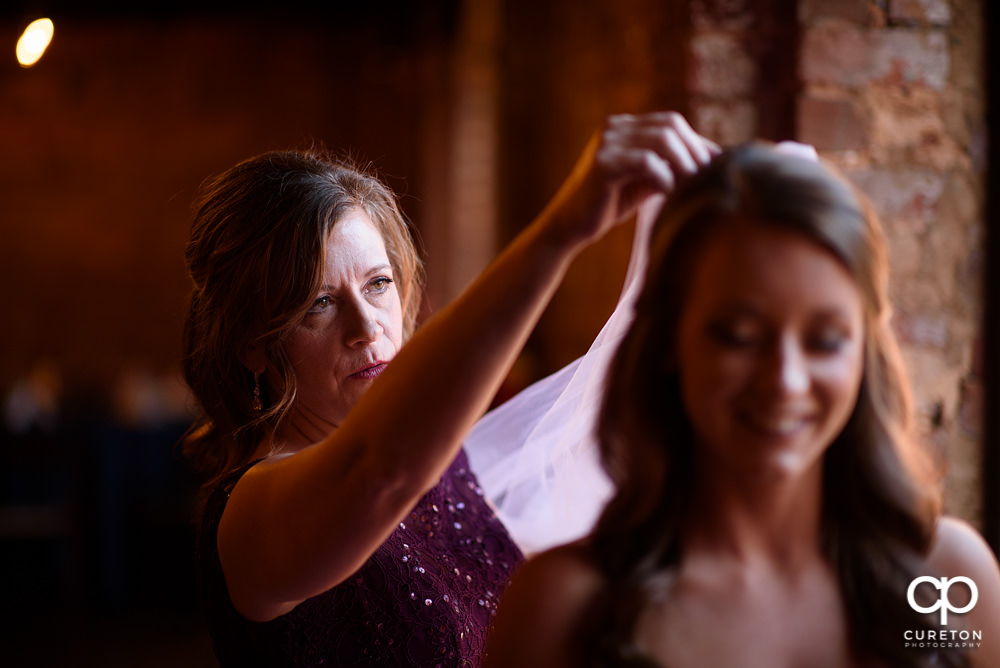 Bride getting into her dress.