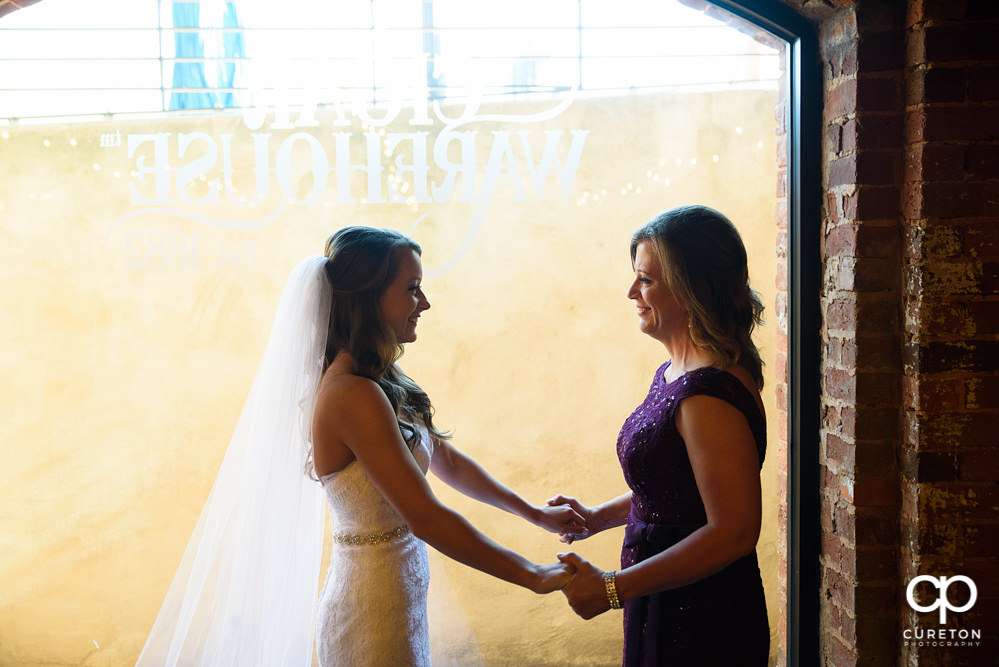 Bride getting into her dress.