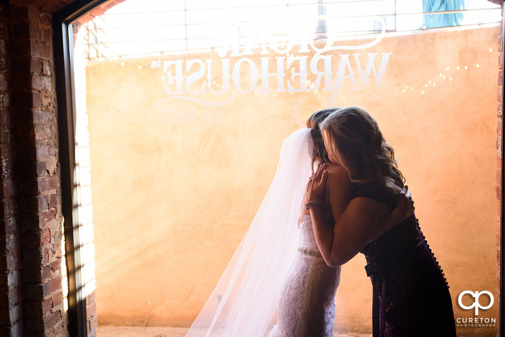 Bride getting into her dress.