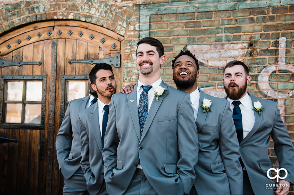 Groomsmen laughing.