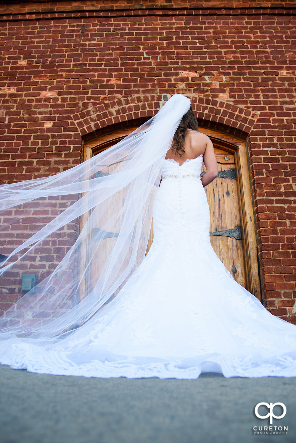 Bride getting ready to walk down the stairs at Old Cigar Warehouse.