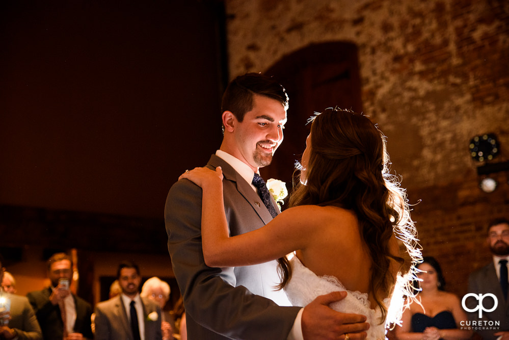 Bride and groom first dance at their wedding reception.