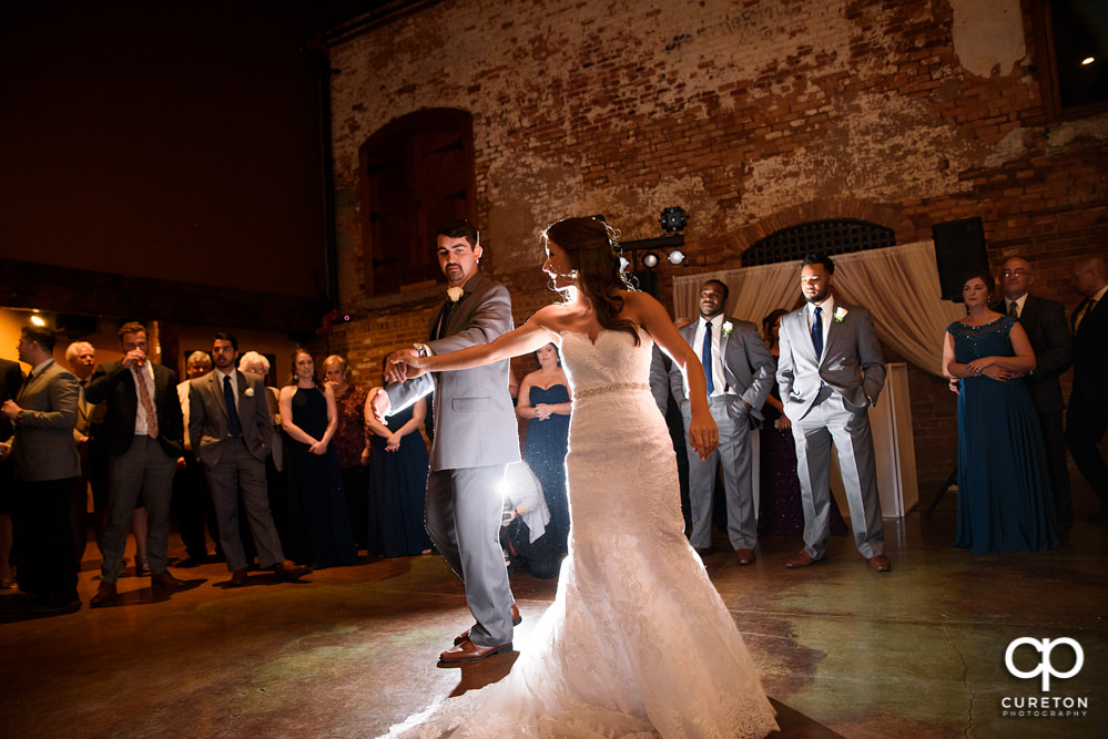 Bride and groom first dance at their wedding reception.