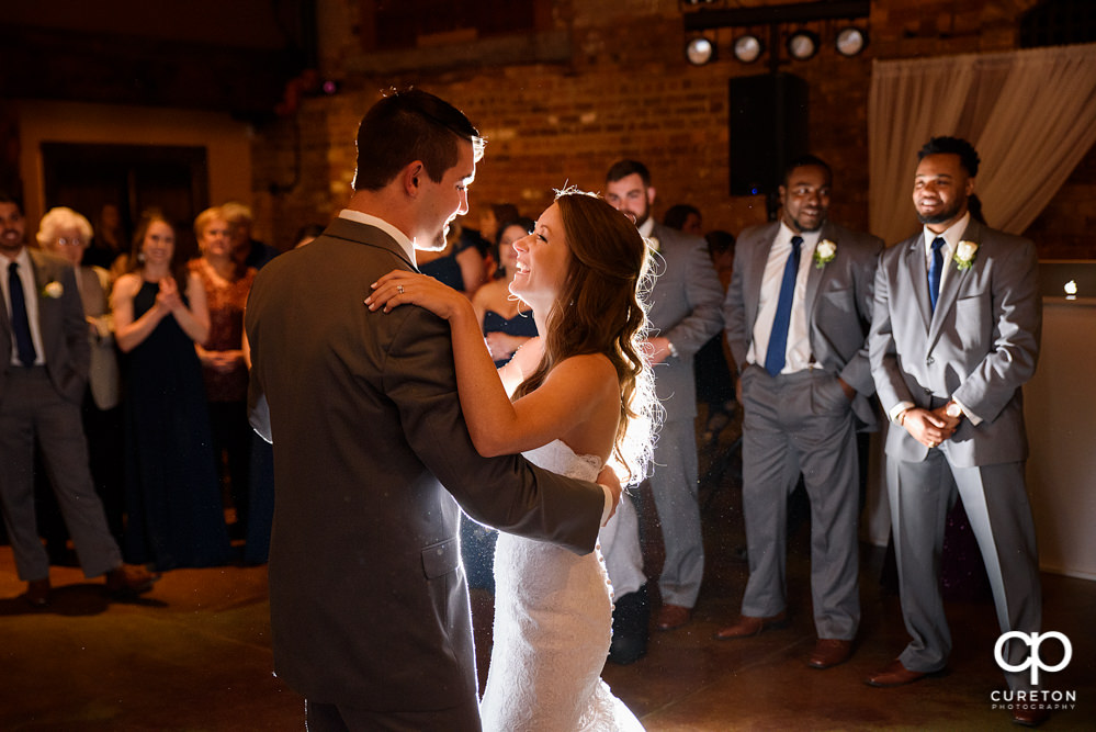 Bride and groom first dance at their wedding reception.